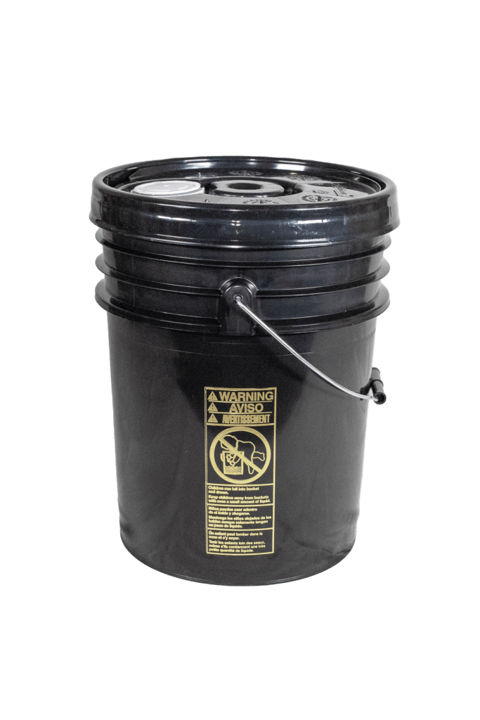 black_plastic_pail_and_lid A black plastic bucket with a metal handle and a lid. A yellow warning label with icons and text is visible on its side. The bucket is placed against a white background.